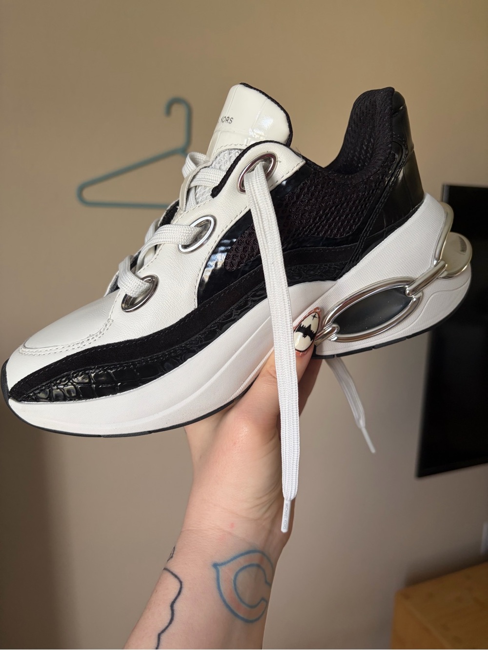 Michael Kors Women's Black and White Platform Sneaker with Metallic Accent